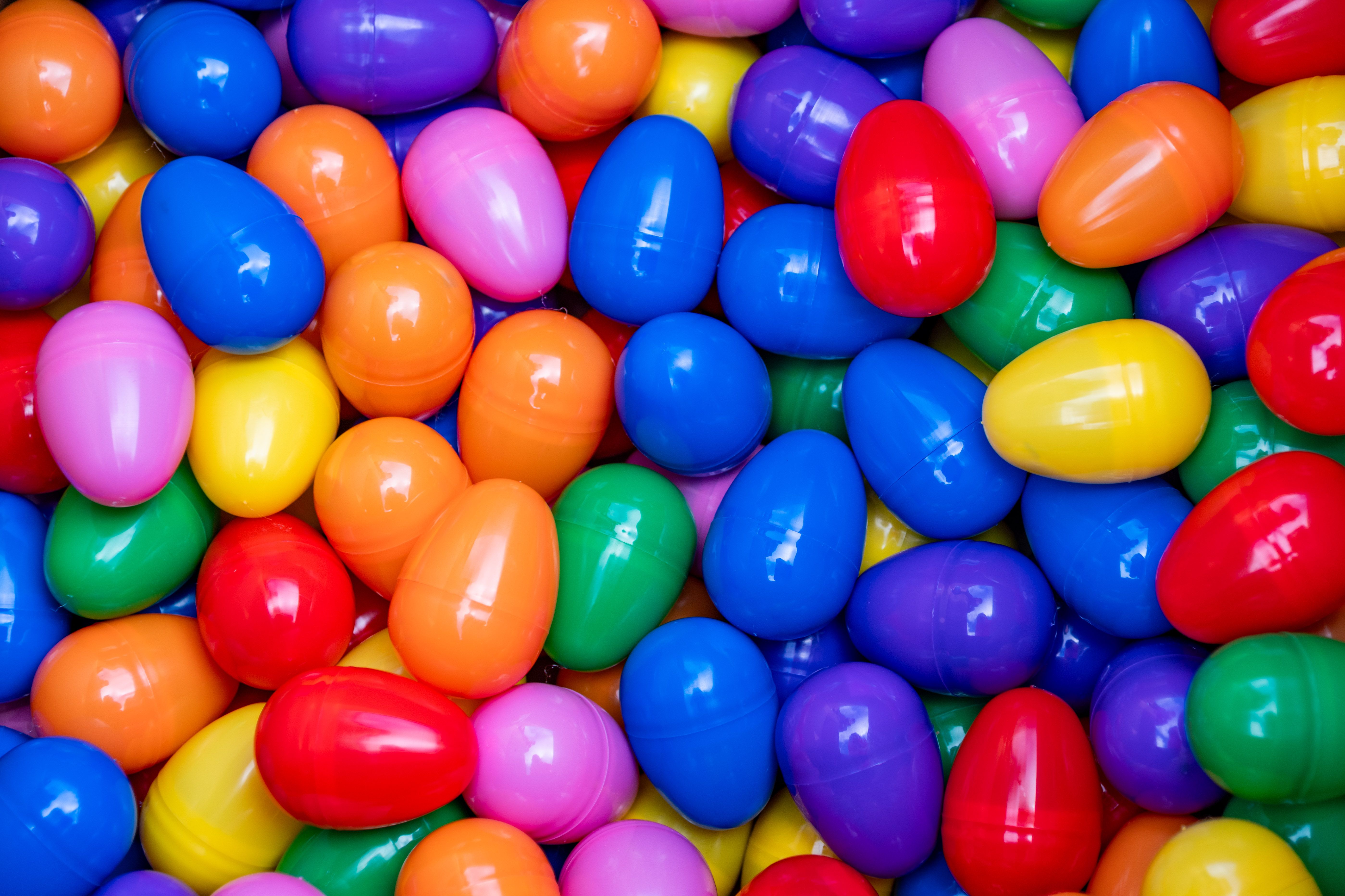 A whole bunch of colorful plastic eggs.
