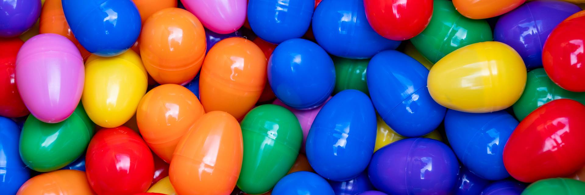 A whole bunch of colorful plastic eggs.
