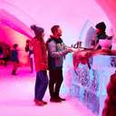 Two people standing at the bar at The Igloo at Sunday River.