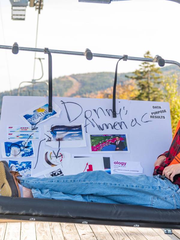 Donny Pelletier on a chairlift with his Almanac