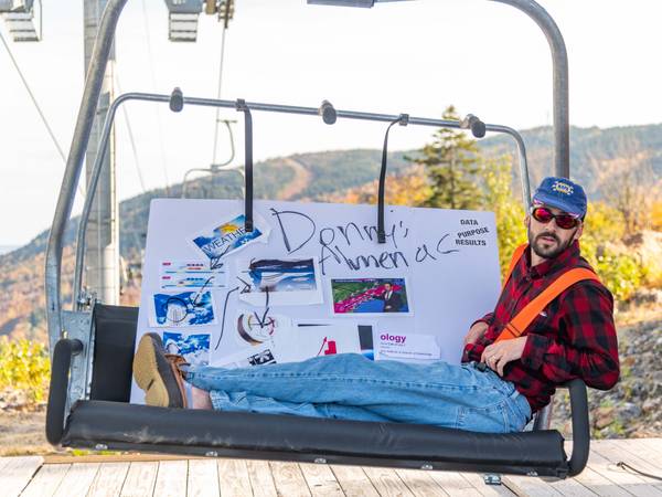 Donny Pelletier on a chairlift with his Almanac