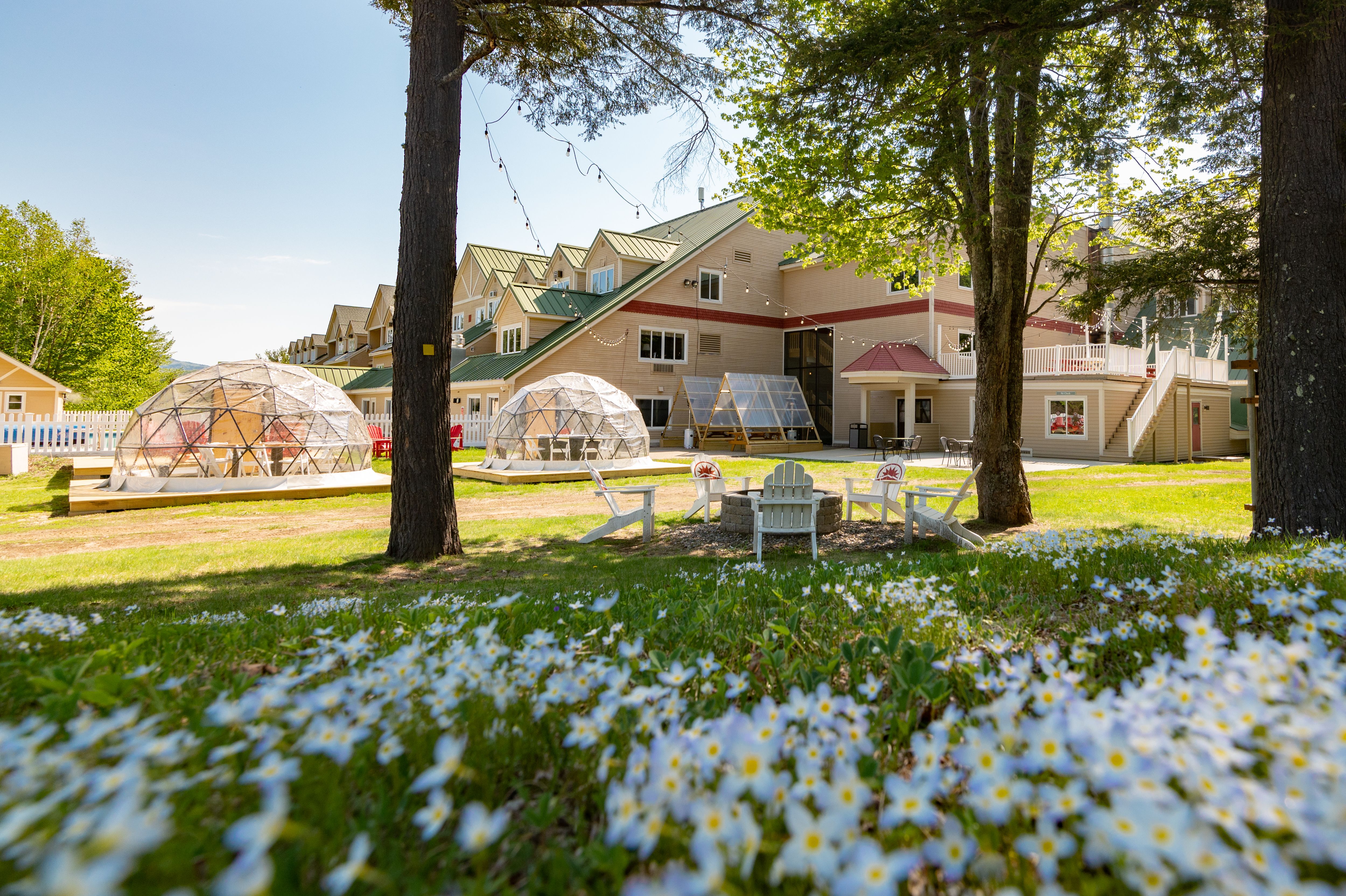 The outside grand entrance to the Grand Summit Hotel at Sunday River Resort in the summer.
