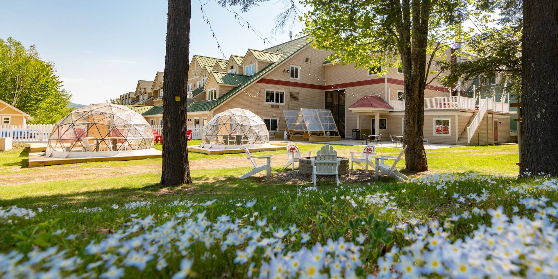 The outside grand entrance to the Grand Summit Hotel at Sunday River Resort in the summer.