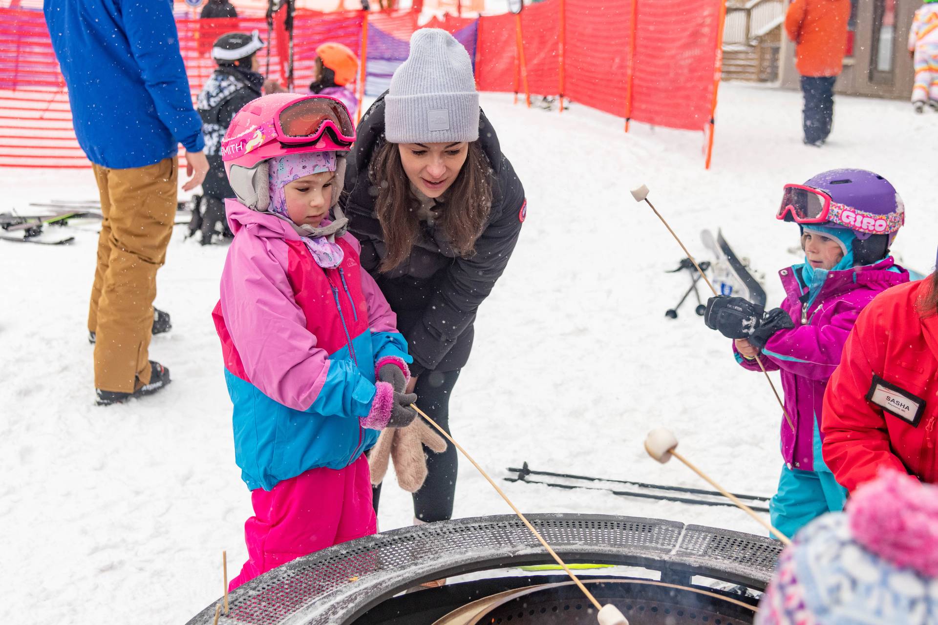 Kids at Sunday River making s'mores.