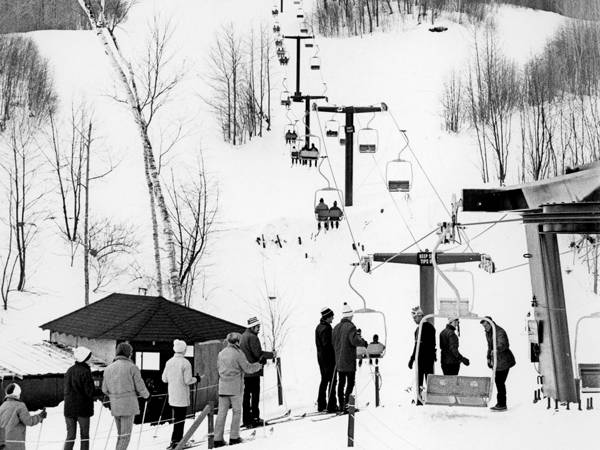 Skiers from the 1950s in line for a lift at Sunday River resort.