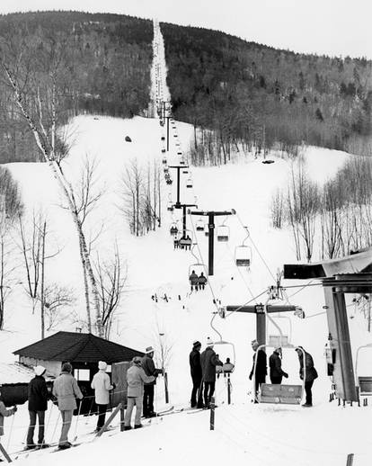 Skiers from the 1950s in line for a lift at Sunday River resort.
