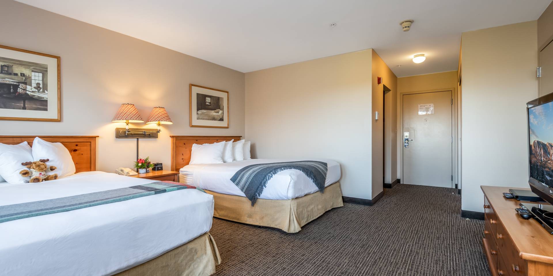 Jordan Hotel room at Sunday River with the beds made.