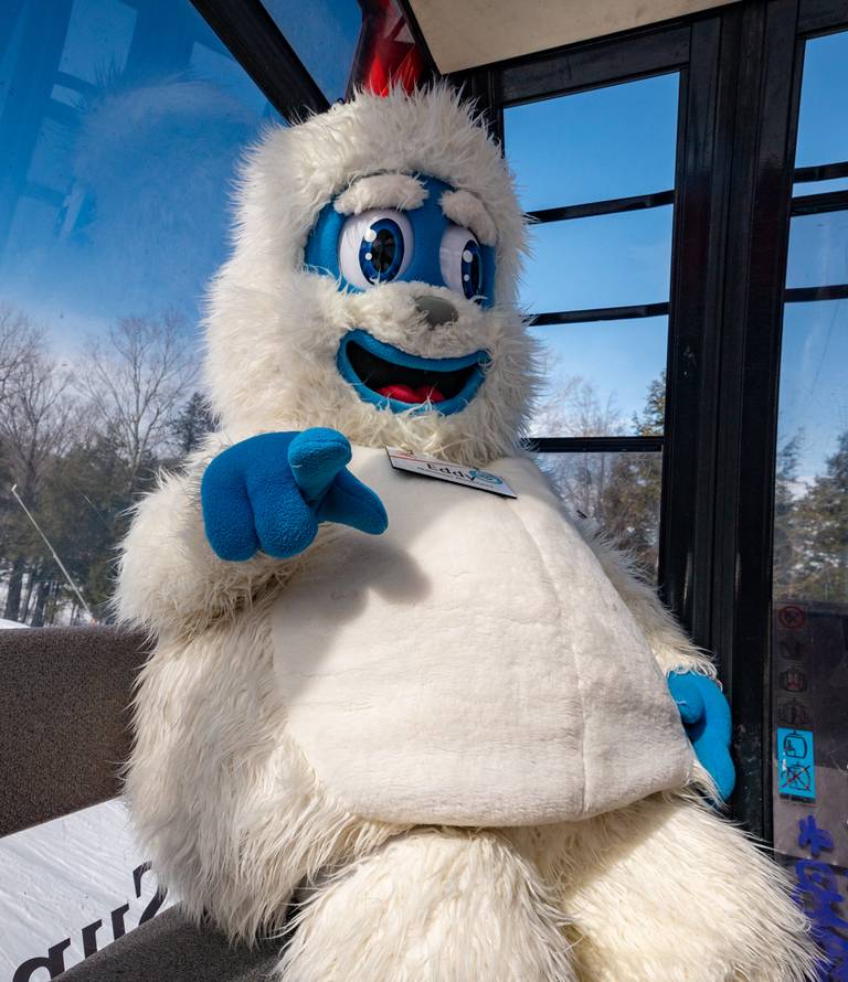 Eddy the Yeti sitting in the Chondola cabin at Sunday River.