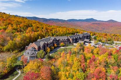 The Jordan Hotel with trees in peak foliage time at Sunday River.