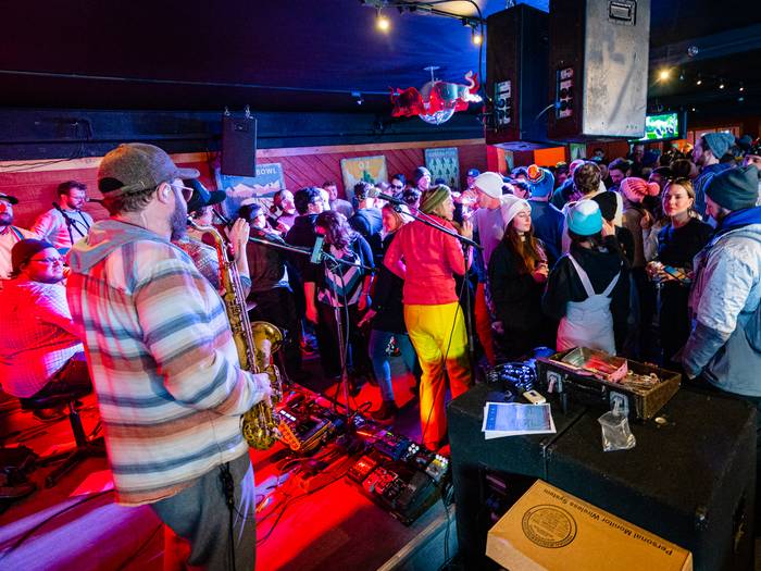 A band playing live music in the Foggy Goggle.