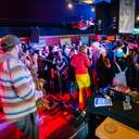 People listening and dancing to music at the Foggy Goggle at Sunday River.