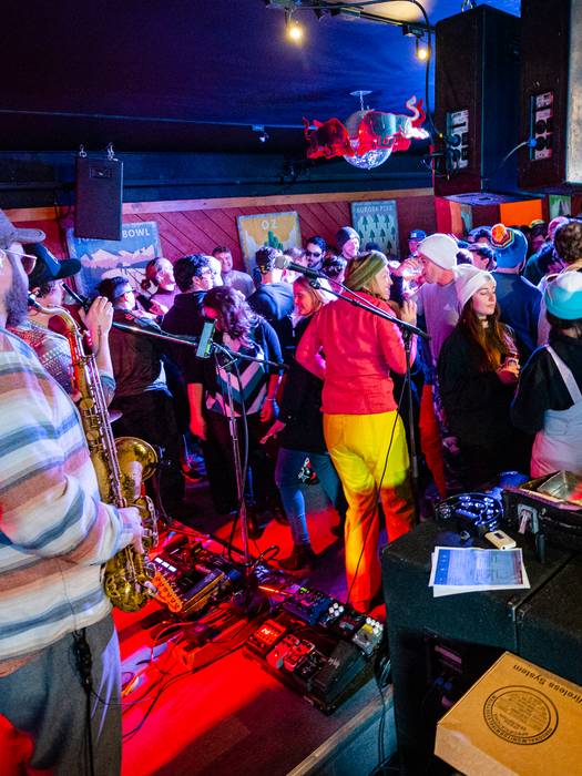 A band playing live music in the Foggy Goggle.