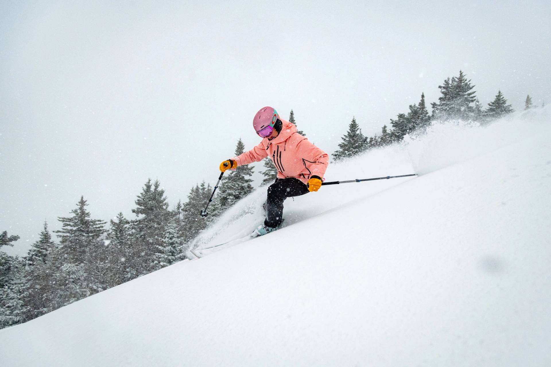 A skier in powder at Sunday River.