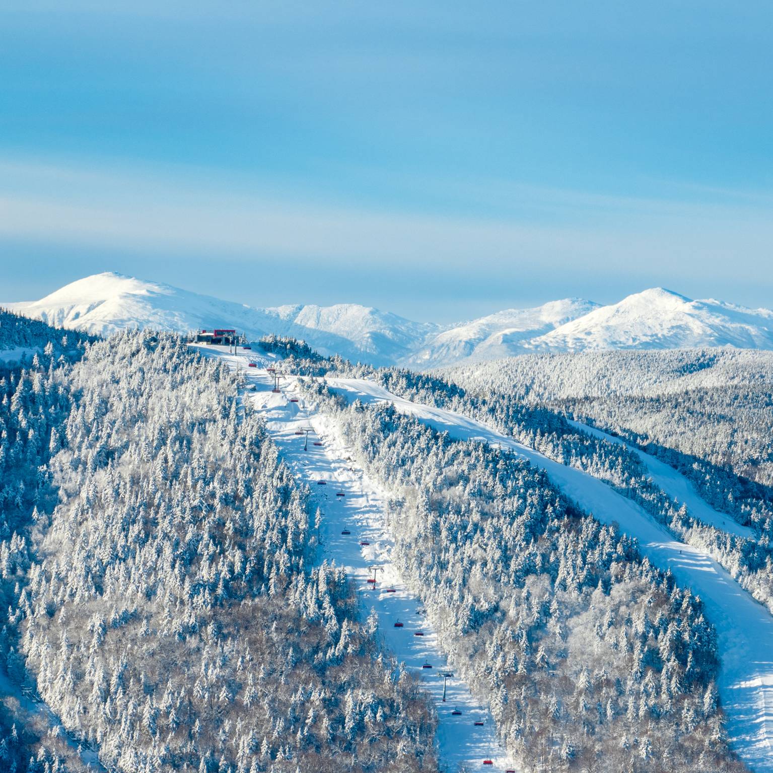 A drone view of the Jordan 8 at Sunday River with the Presidential Mountain Range in the background.