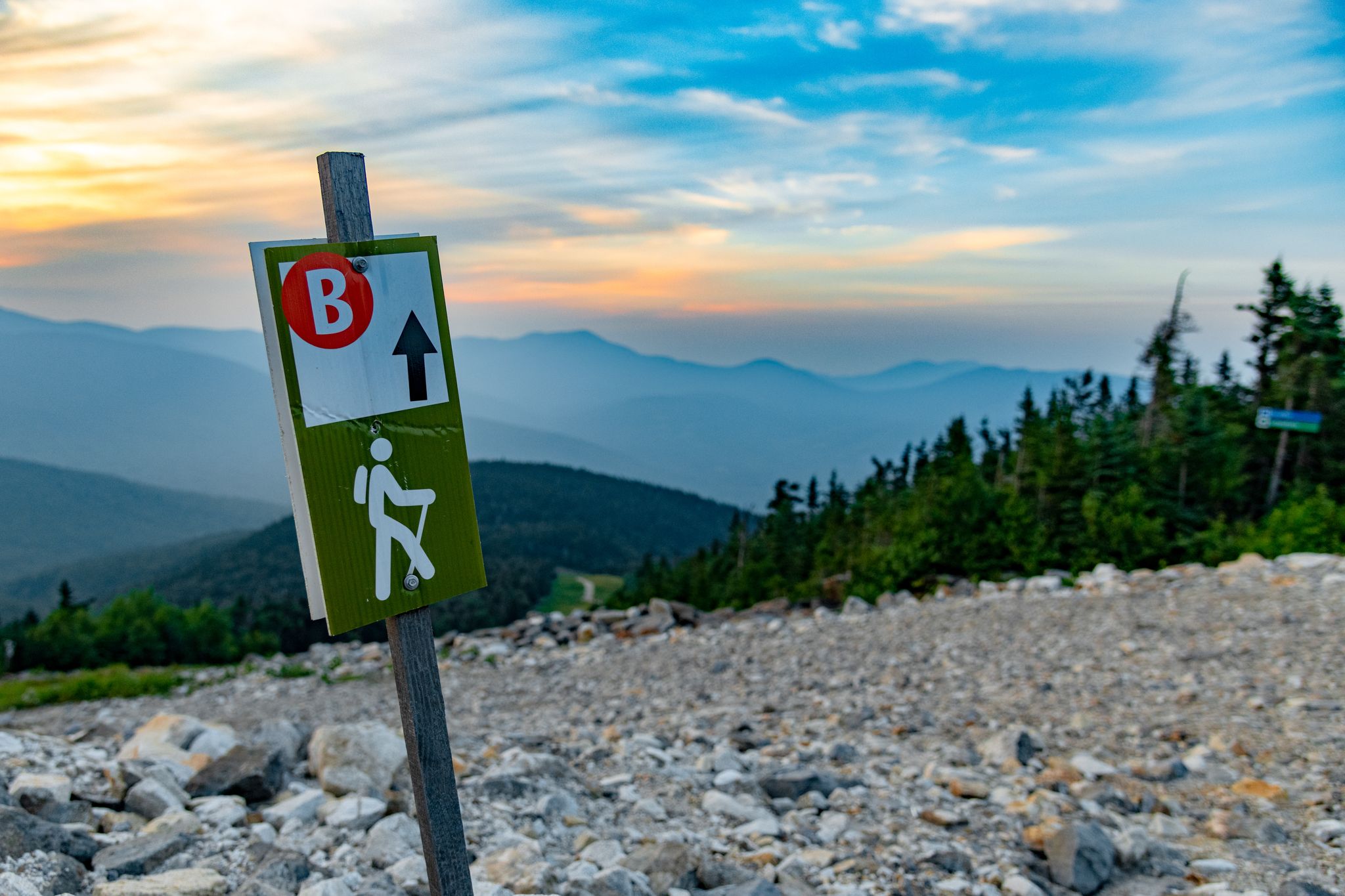 A trail sign at Sunday River for hiking trails in the summer.