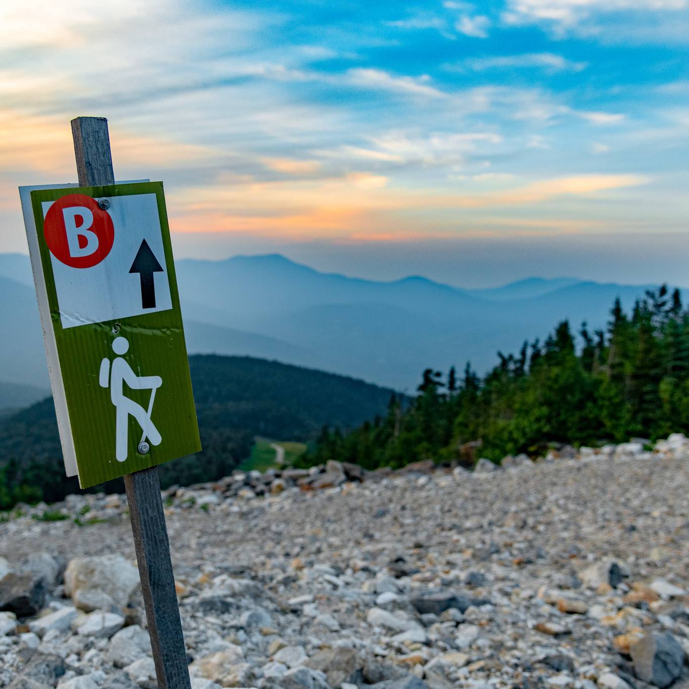 A trail sign at Sunday River for hiking trails in the summer.