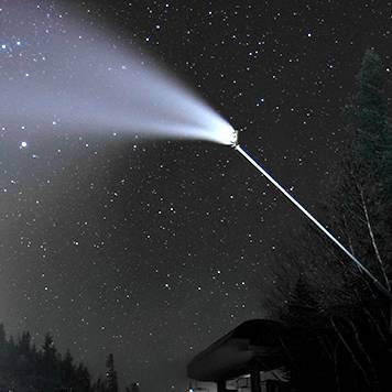 A snowgun making snow at Sunday River at night time.