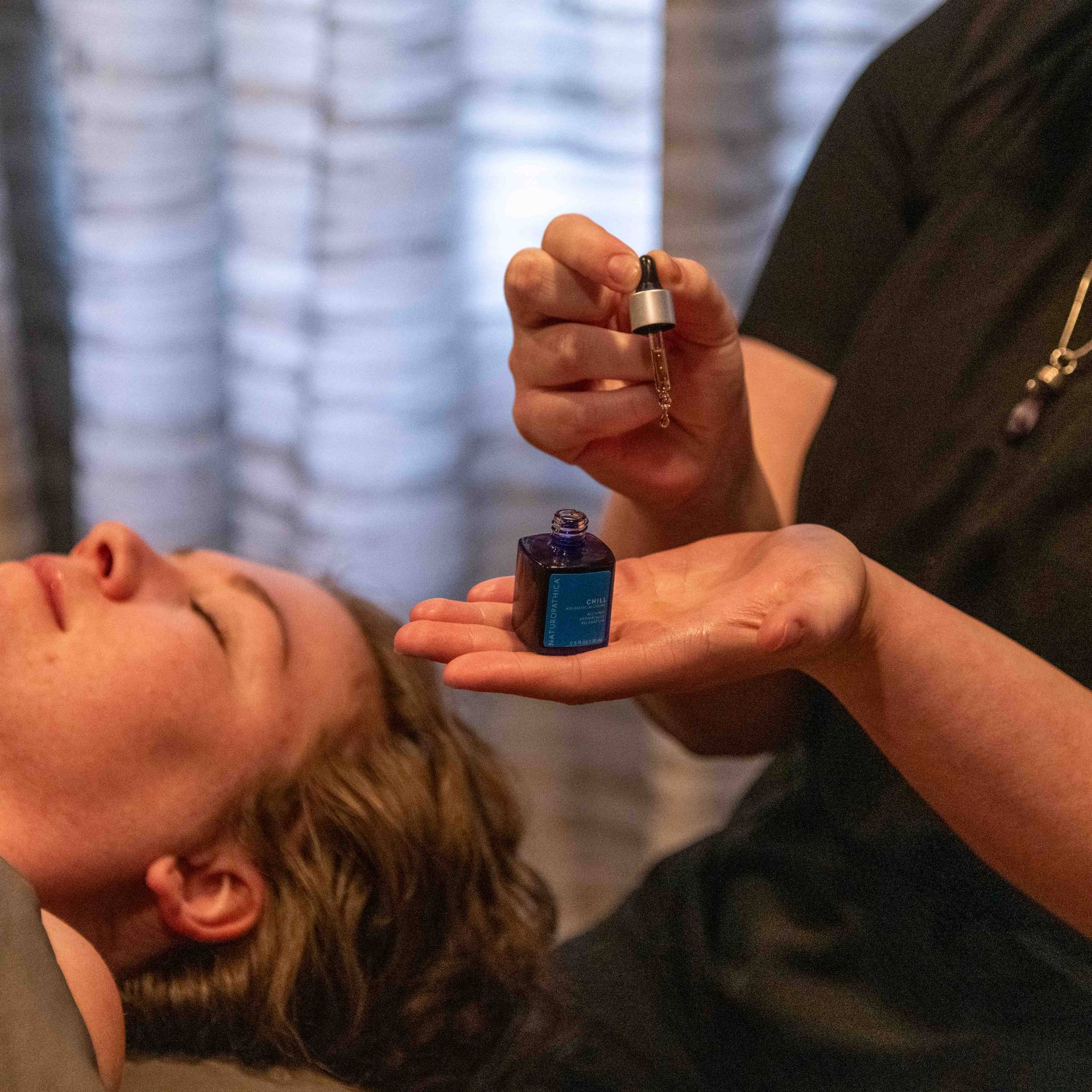 A woman receiving a facial at Sunday River's spa.