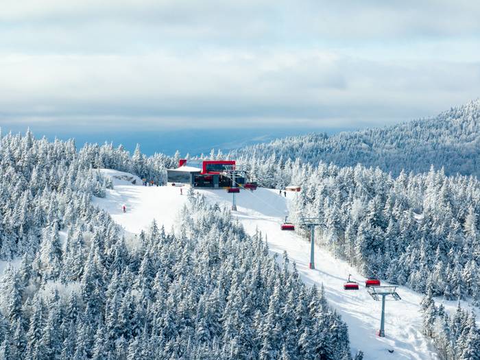 Barker 6 with skiers and riders at Sunday River in the winter.