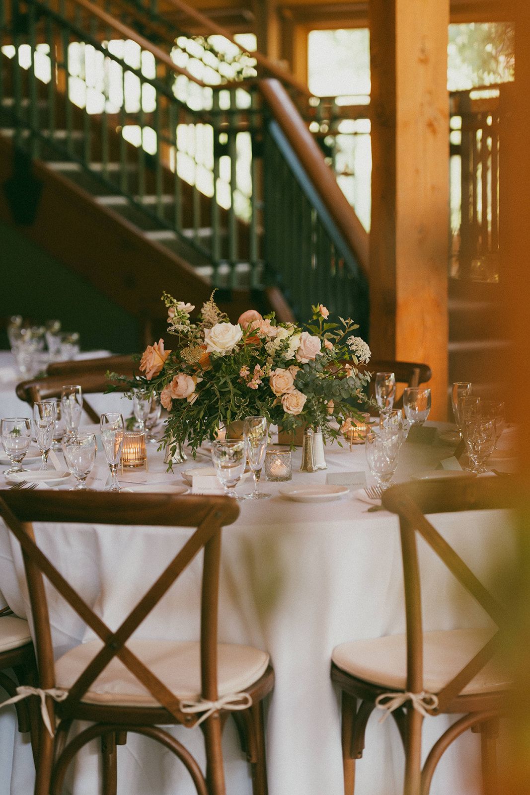 Flowers on a set table for a wedding.