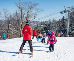 A SnowSports instructor at Sunday River giving a ski lesson.