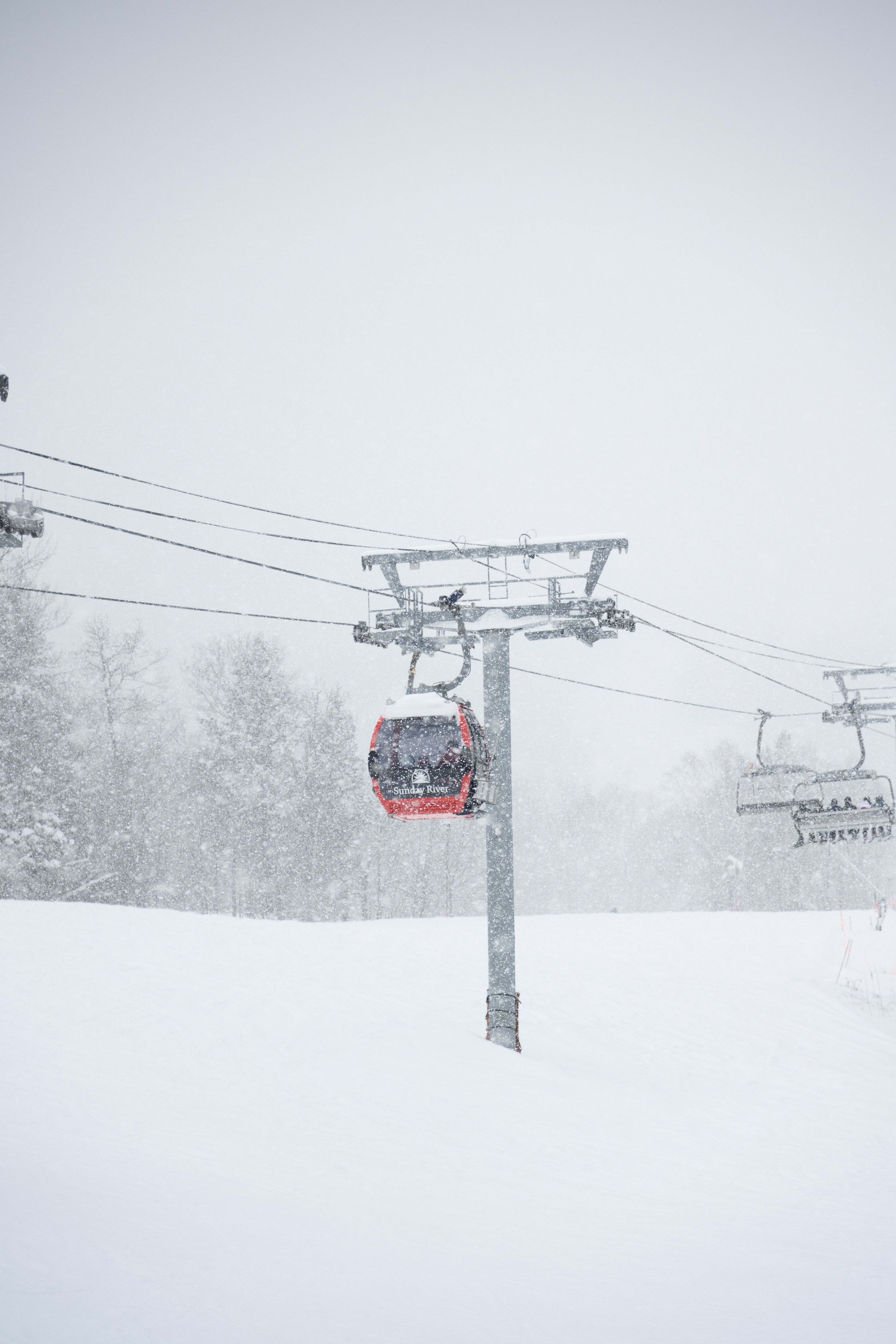 The Chondola lift at Sunday River on a snowy winter day.