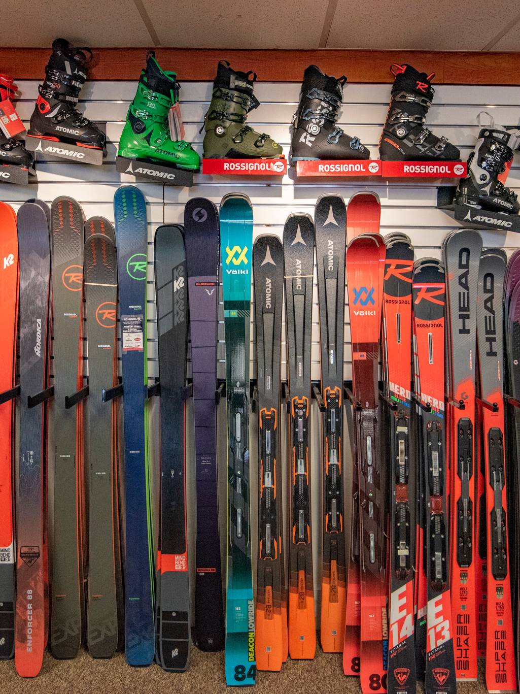 Ski and boot wall display at Sunday River Sports.