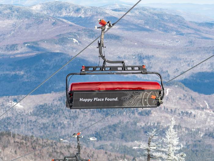 The back of the Barker 6 chair at Sunday River with the words, "Happy Place Found."