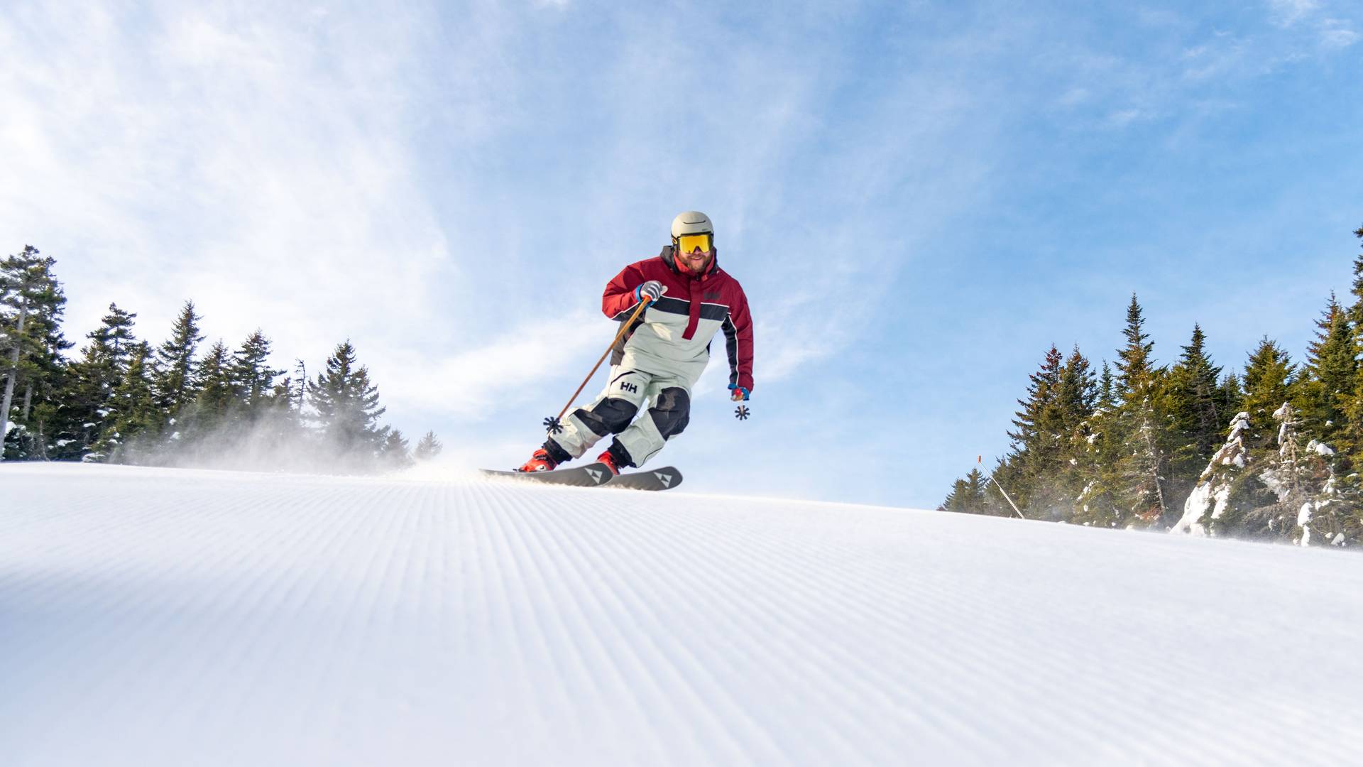 A skier carving through the snow.