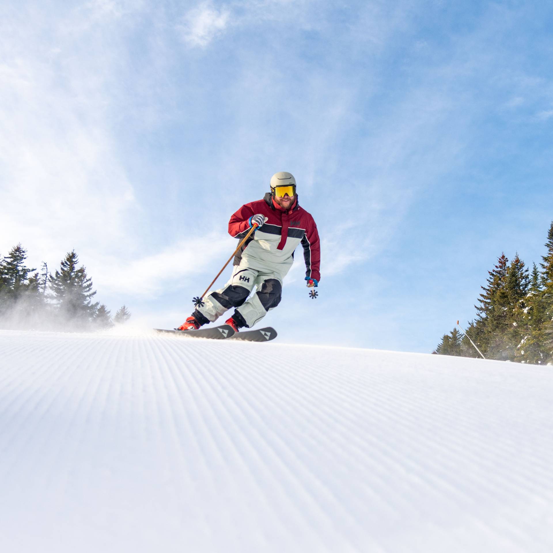 A person skiing on fresh stripes at Sunday River.