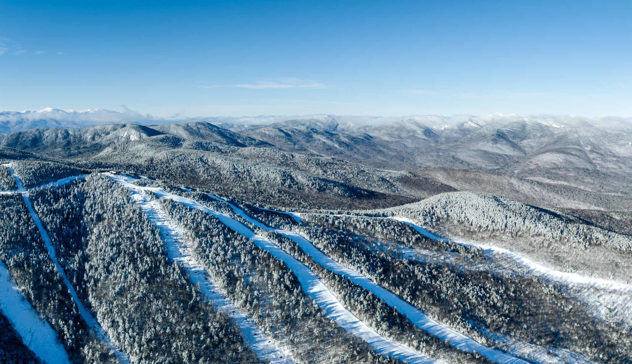 Sunday River trails covered in snow across a few peaks.