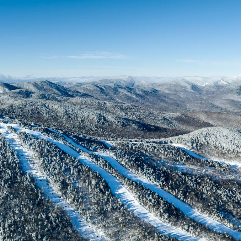 Sunday River trails covered in snow across a few peaks.