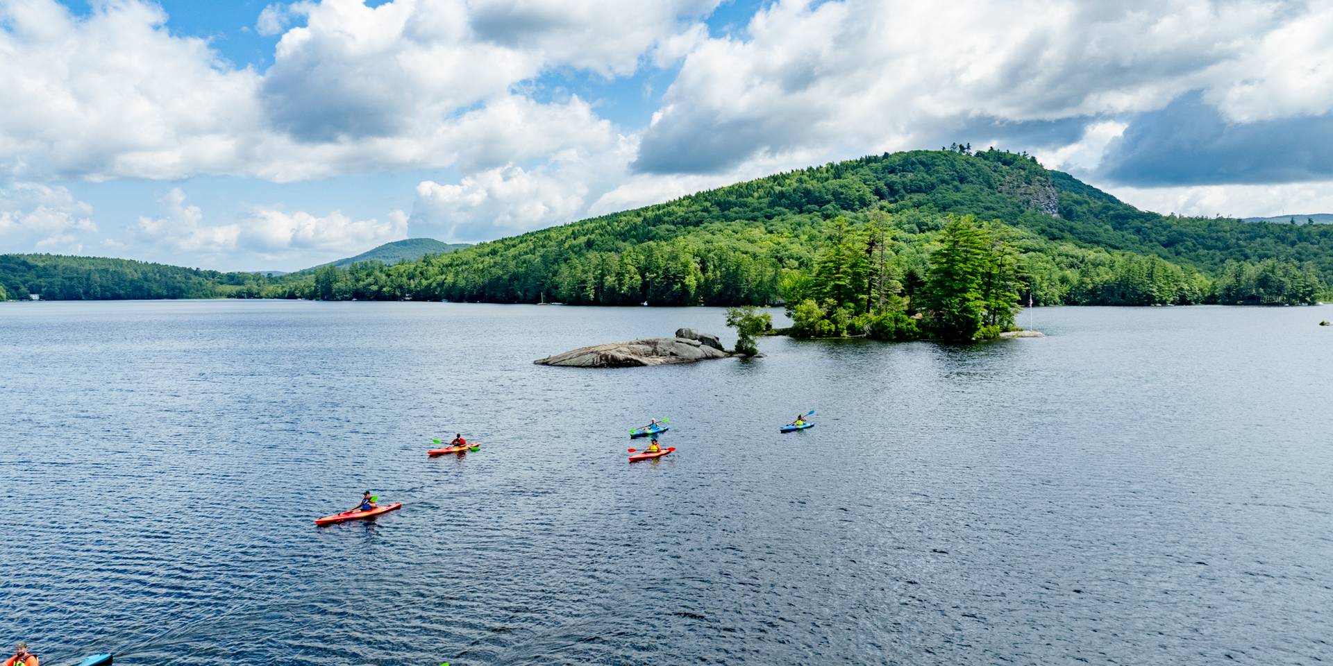 A group of kayakers with Sunday River Outfitters.