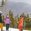 A group of friends on a trail at Sunday River in the winter.