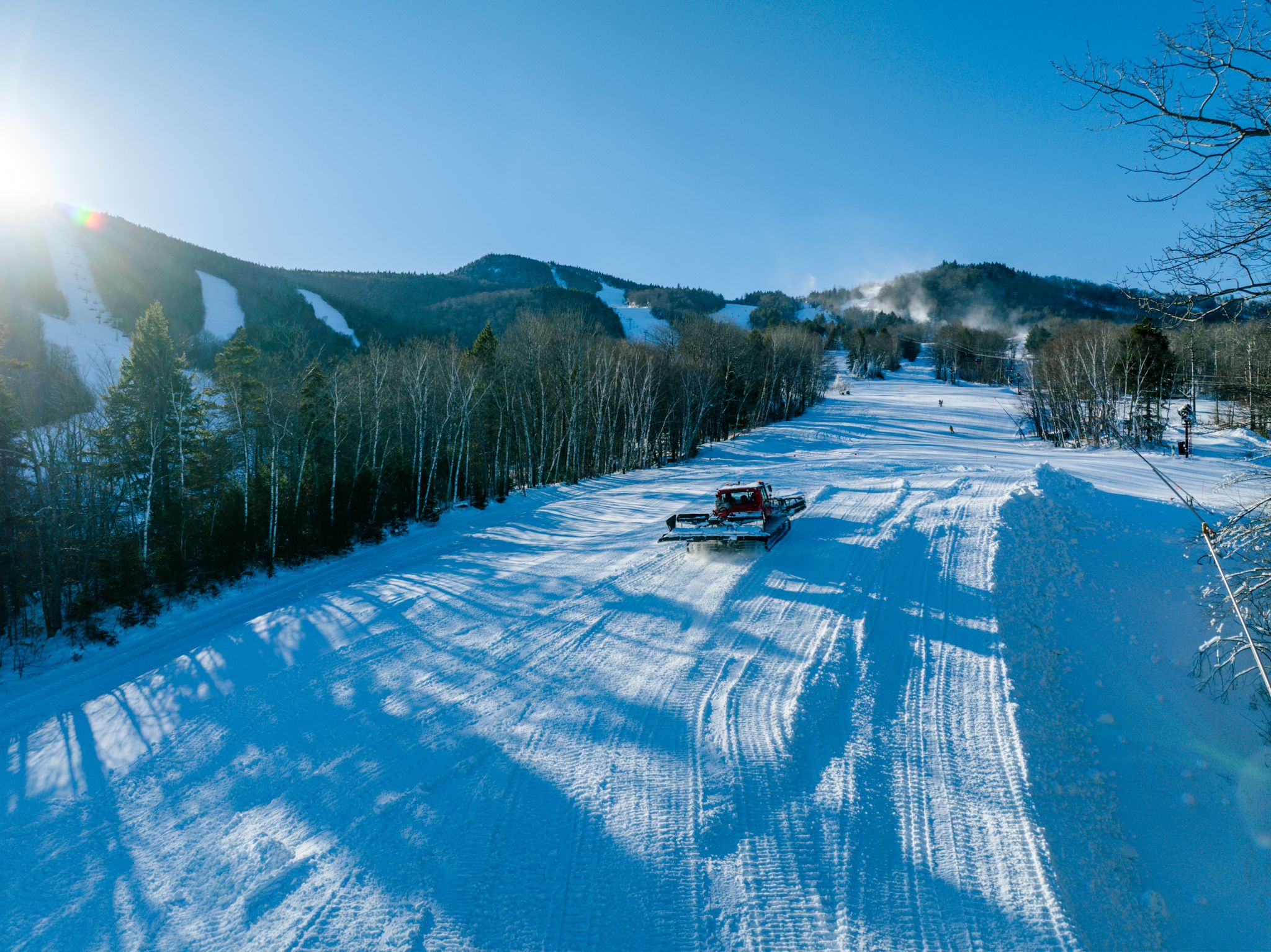 A groomer building out a terrain park feature at Sunday River.