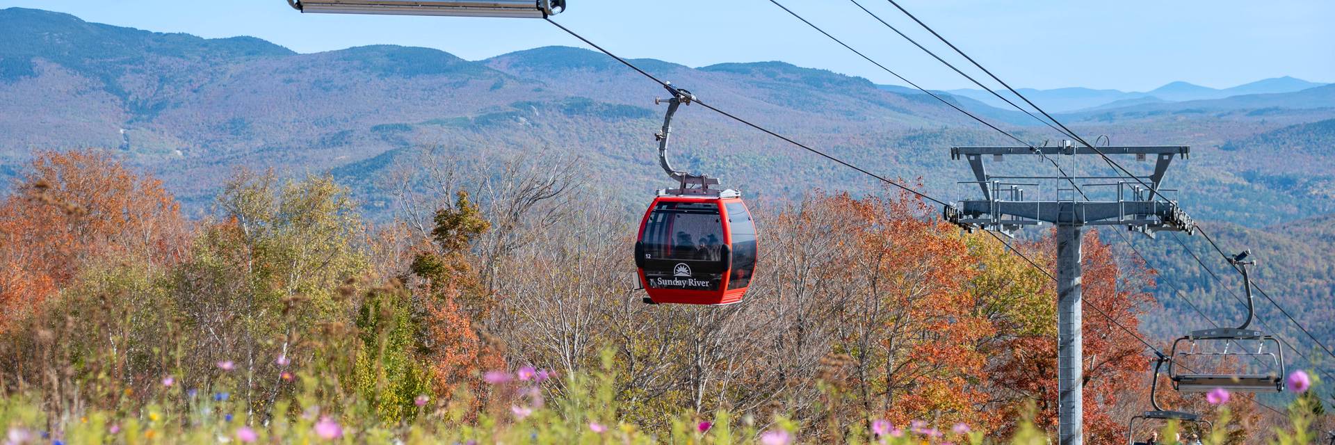 Fall foliage with the Chondola in the background.