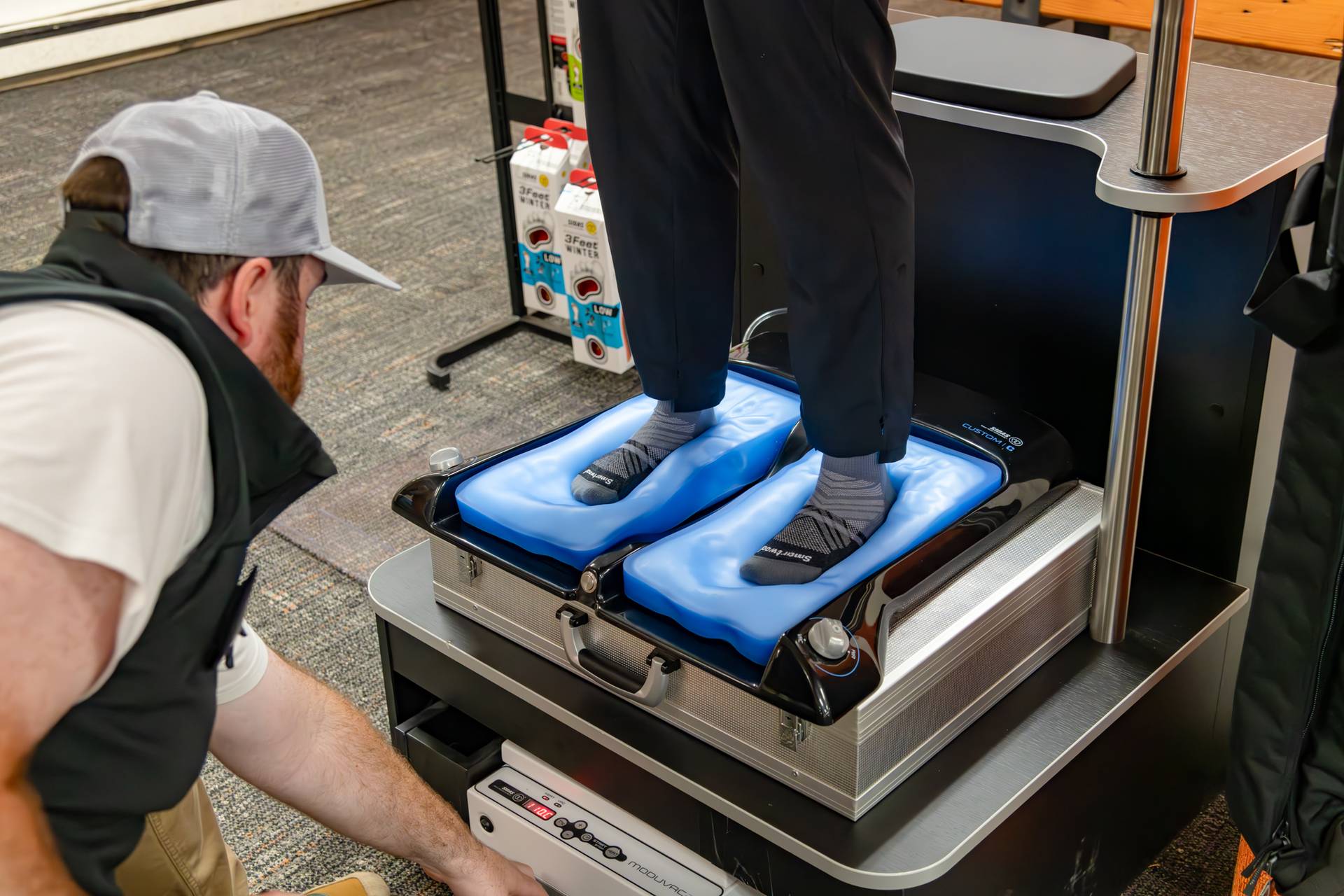A woman getting her feet molded for footbeds at Sunday River Sports.