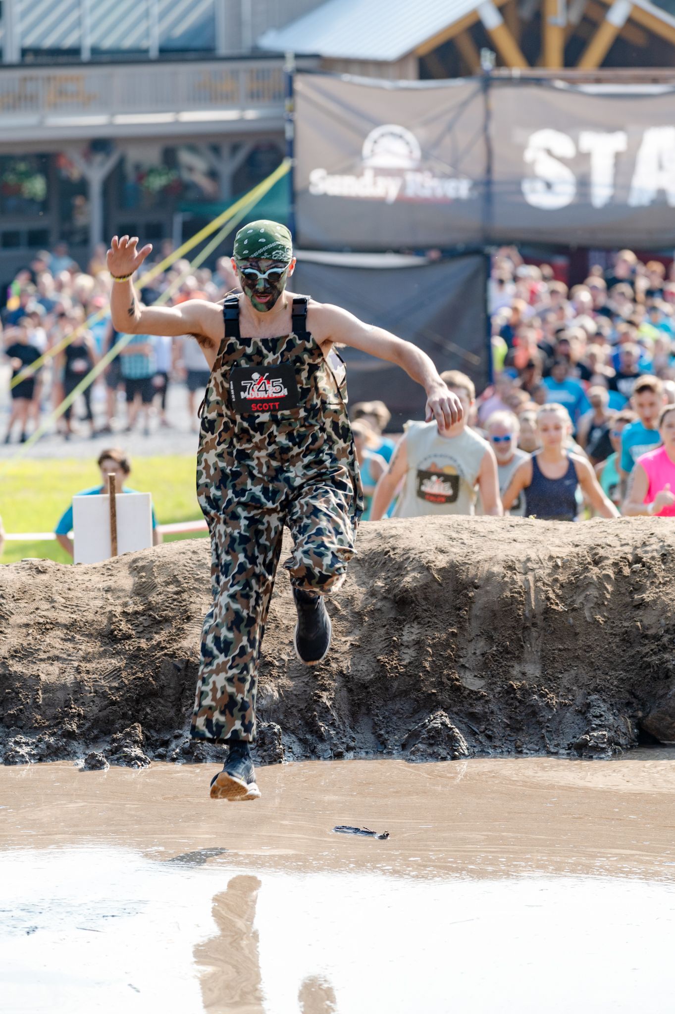 A woman flying into the water at Sunday River's Tough Mountain Challenge.