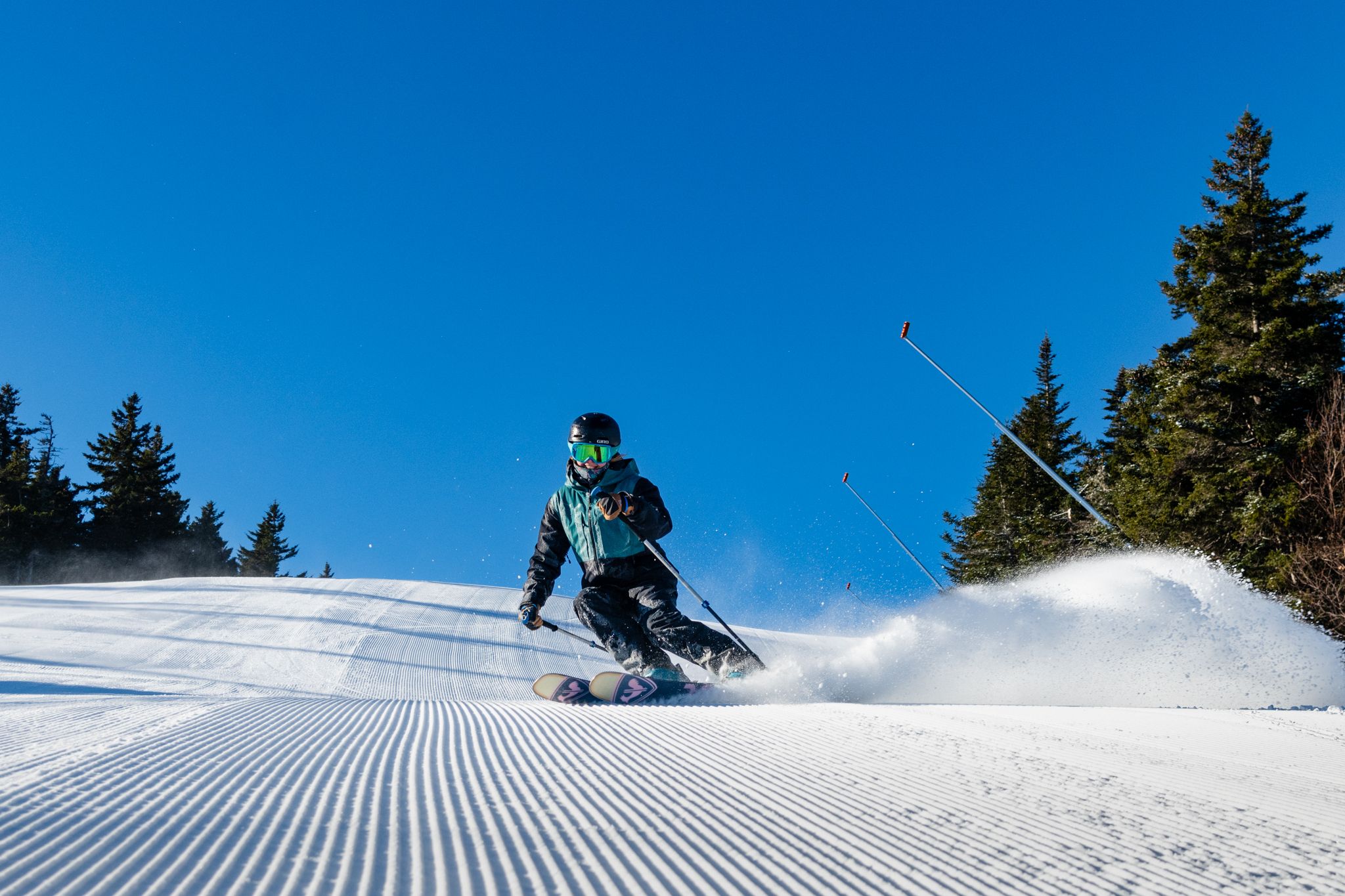 A person skiing down a trail at Sunday River.
