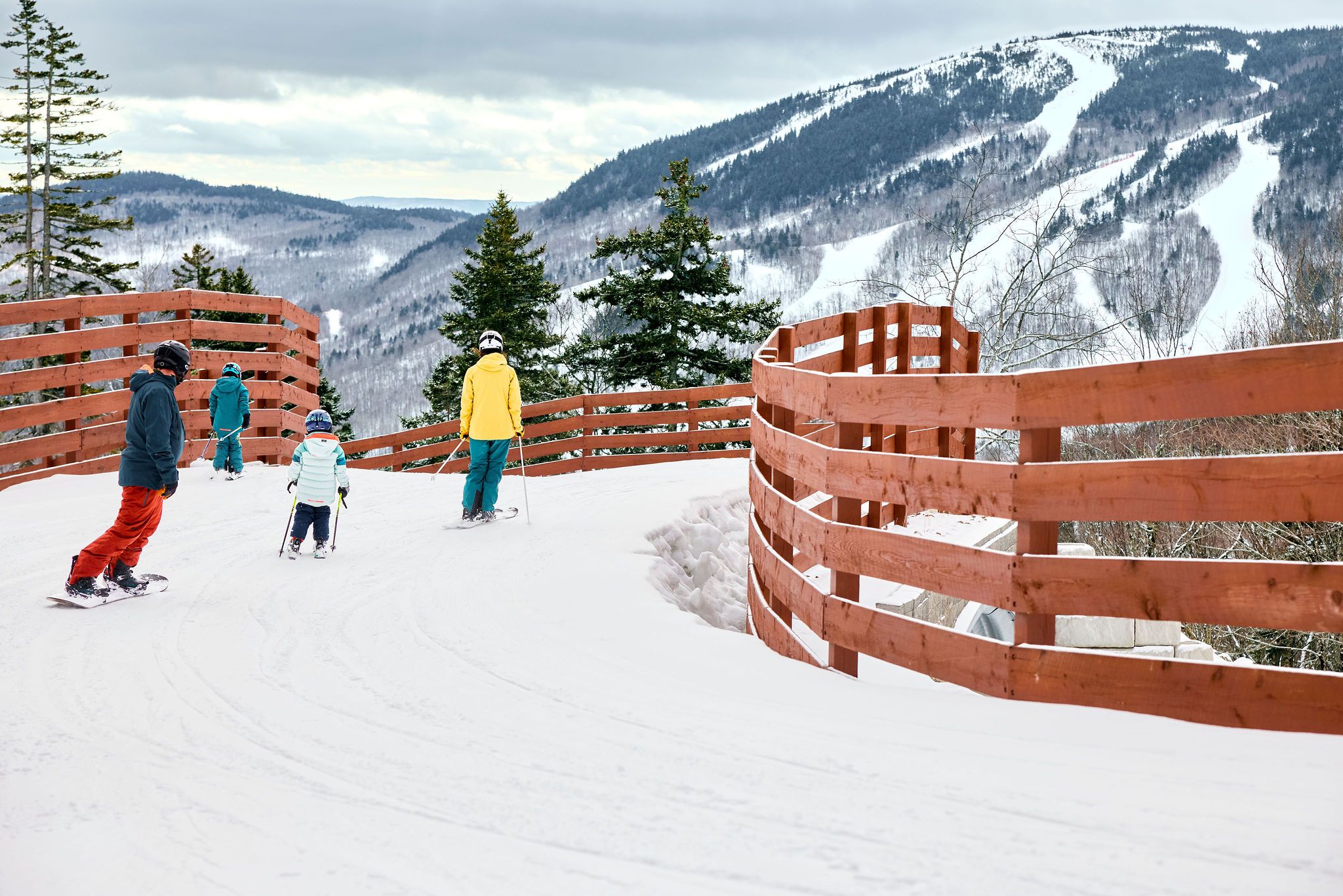 A family skiing at Merrill Hill at Sunday River.