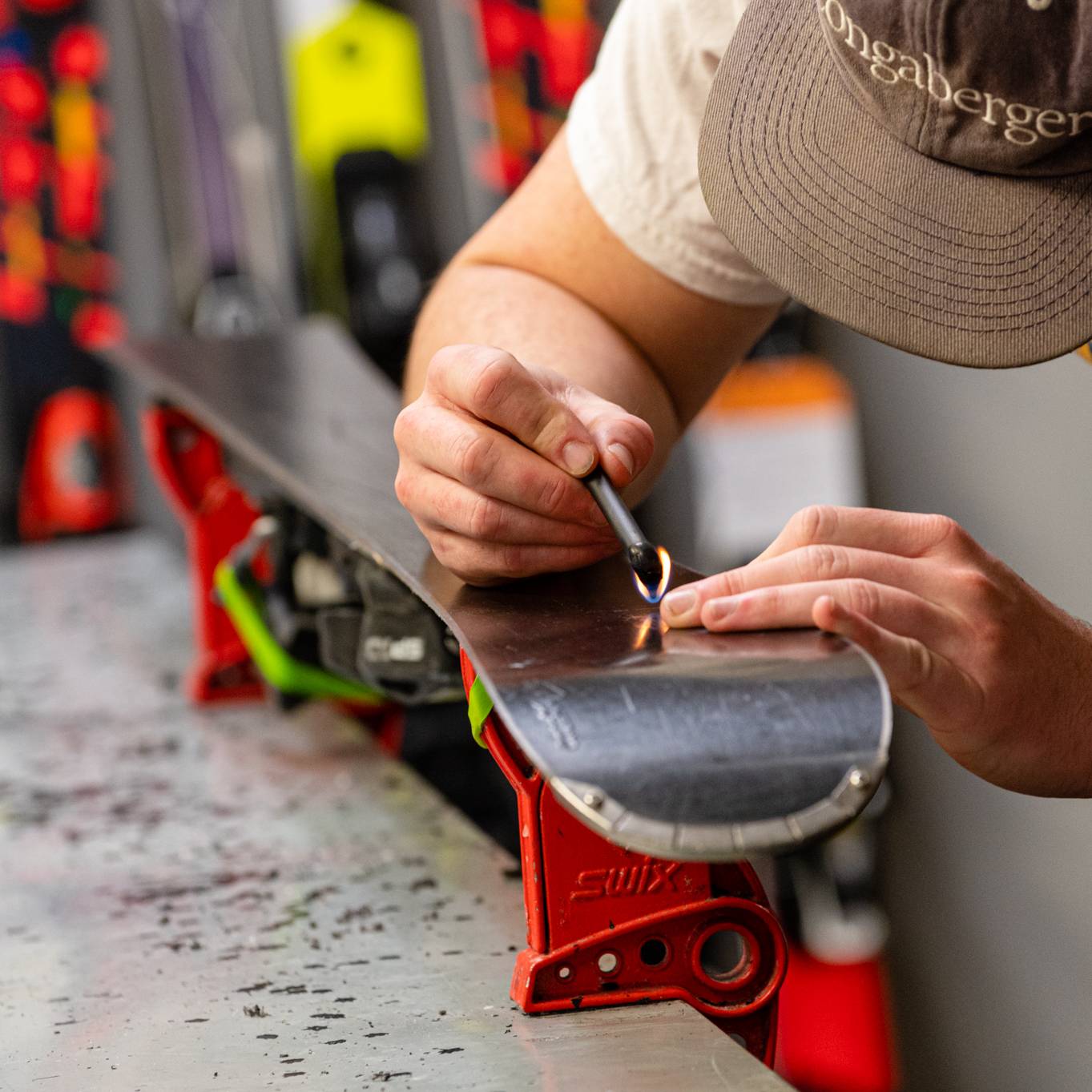 A person tuning skis at Sunday River's Tune Shop.