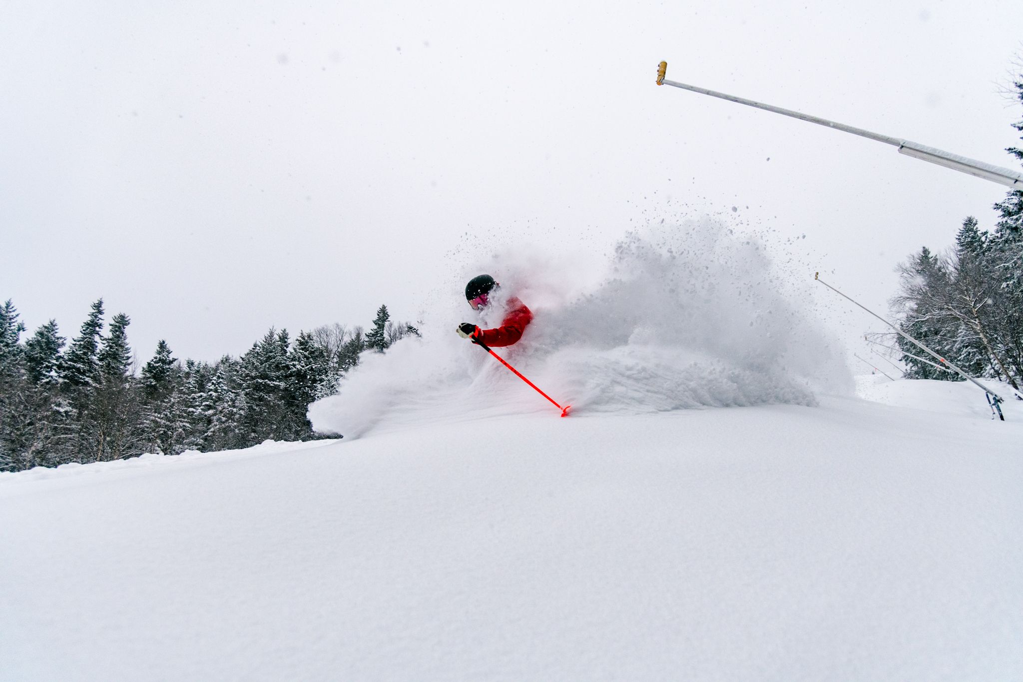 Skier in fresh powder at Sunday River.