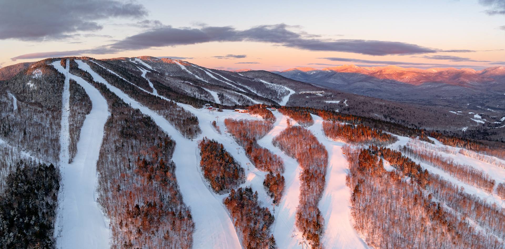 Sunrise over North Peak at Sunday River in the winter.