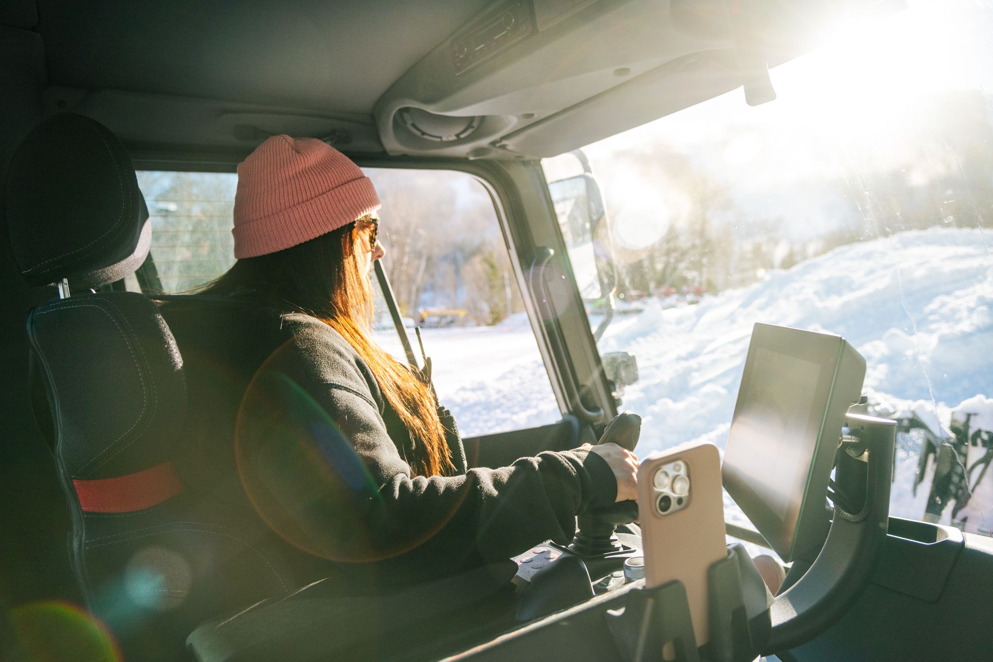 Erika Roy operating a PistenBully snow cat