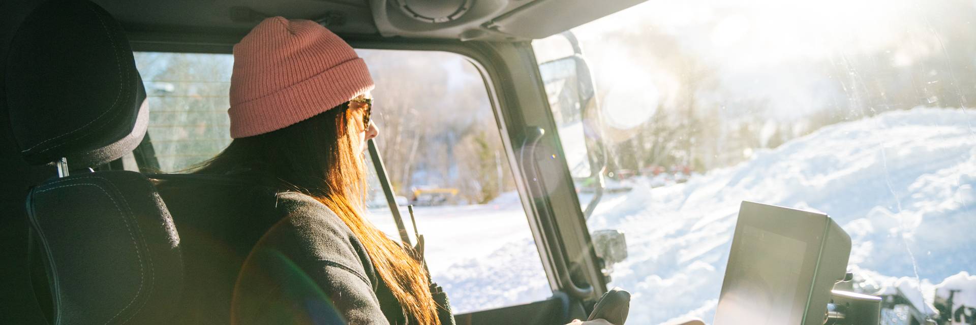 Erika Roy operating a PistenBully snow cat