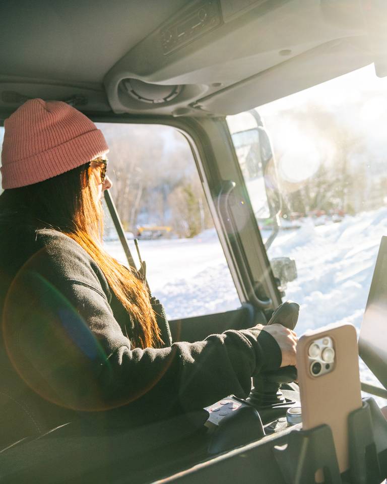 Erika Roy operating a snow cat at Sunday River.