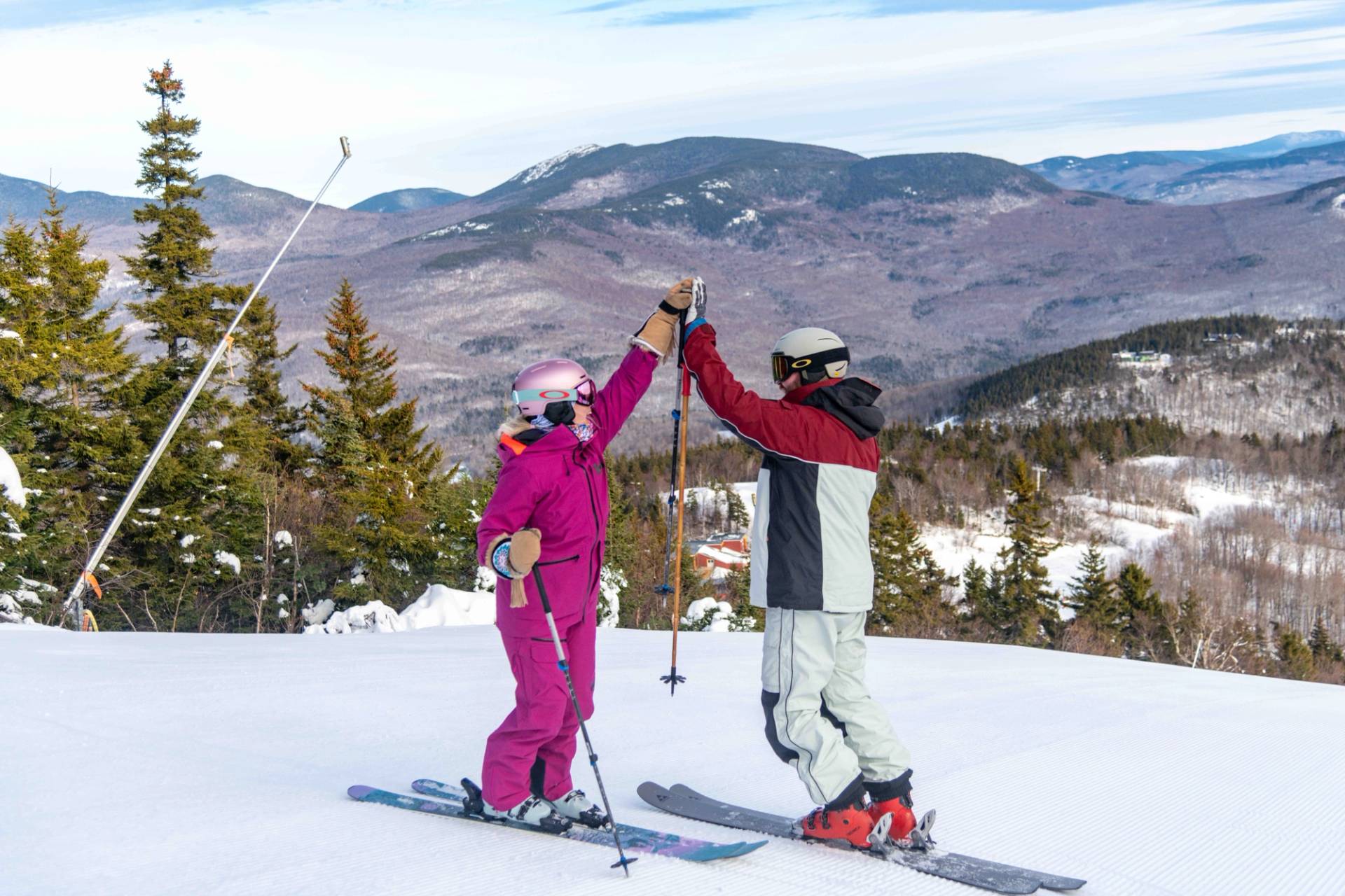 Two people high-fiving at Sunday River.