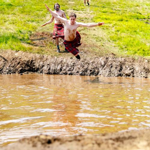 A guy flying into the water at Sunday River's Tough Mountain Challenge.