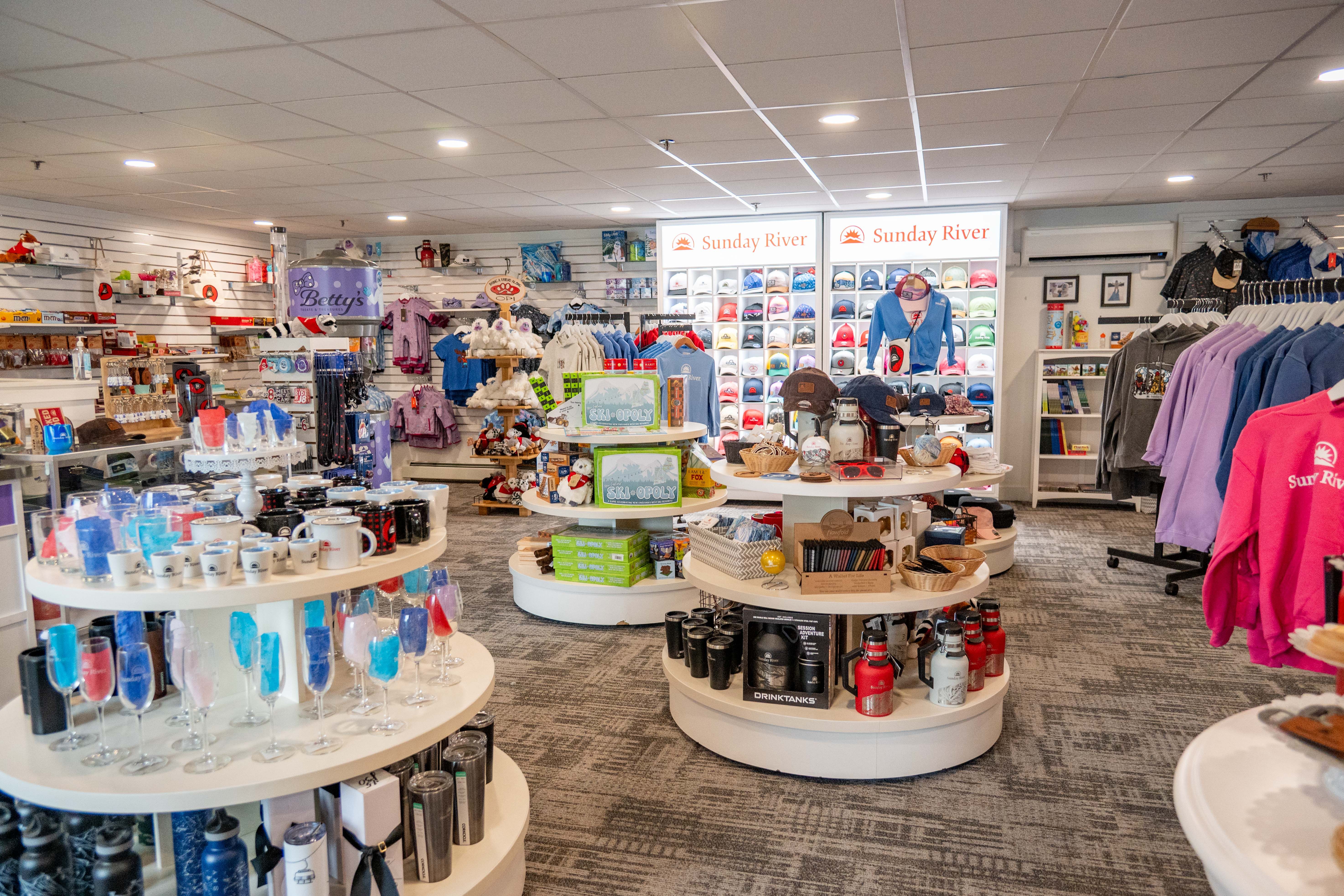 Inside Betty'y store with hats, sweatshirts, and glassware.