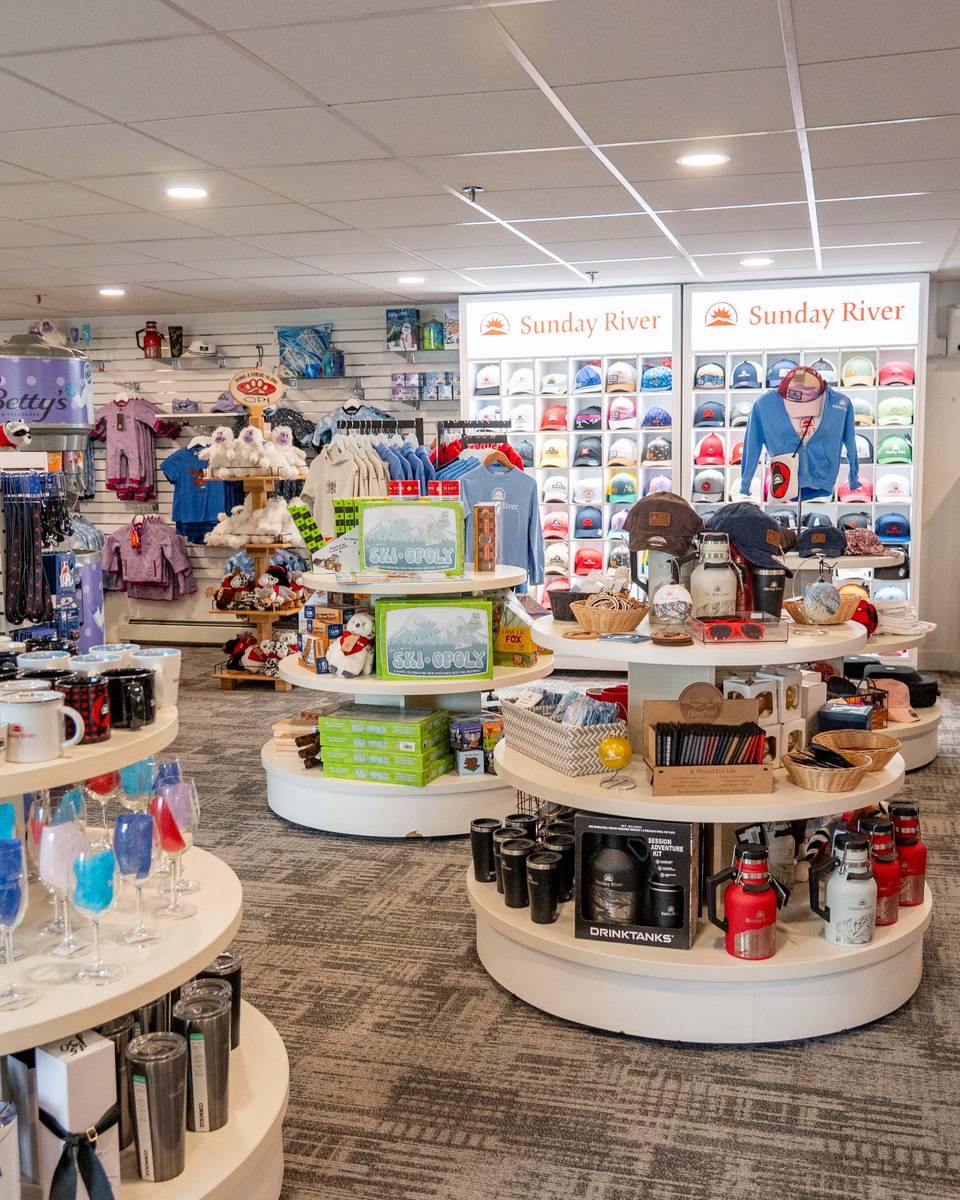 Inside Betty'y store with hats, sweatshirts, and glassware.